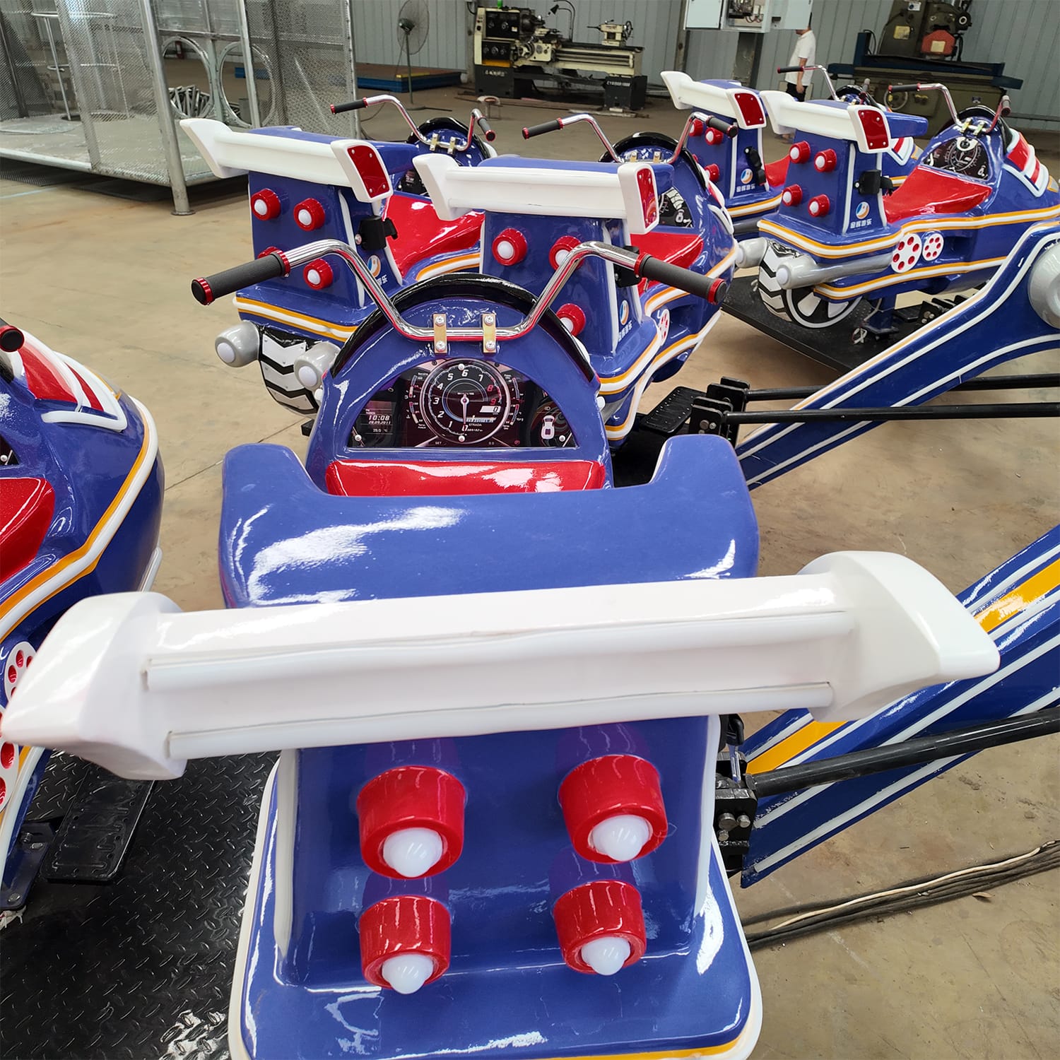 Space Ranger Ride passenger seats with safety harnesses and cosmic detailing