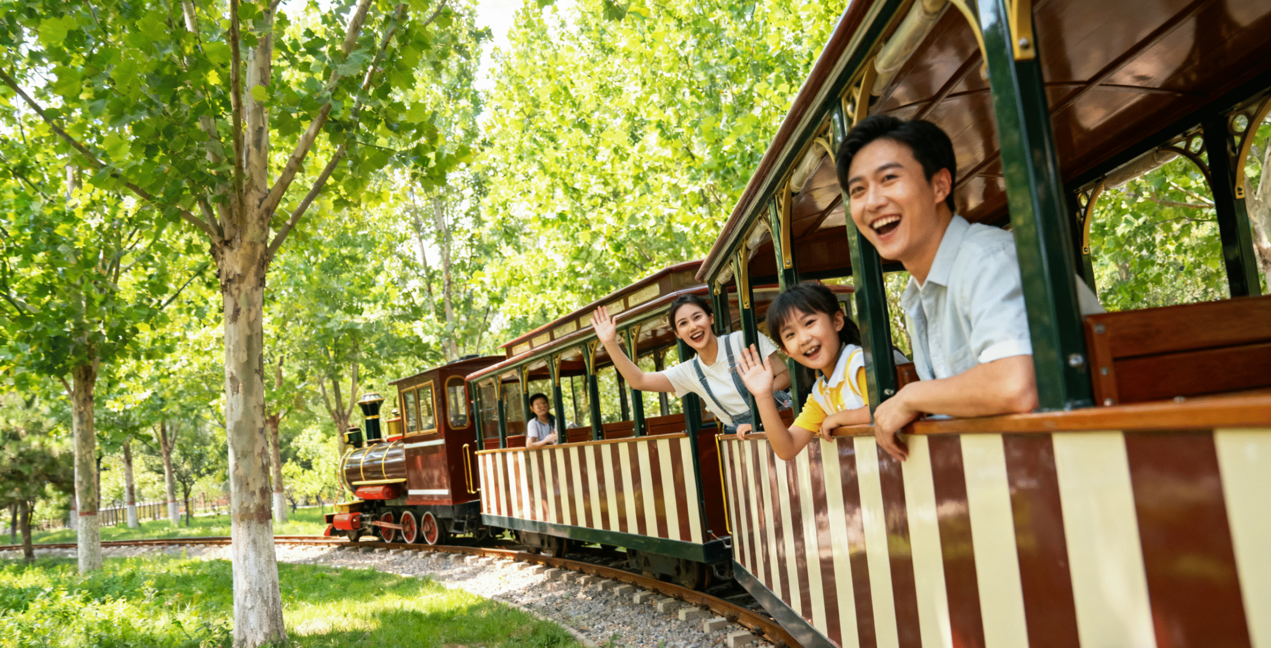Vintage style tourist train showing classic design details with wooden interior and brass fittings