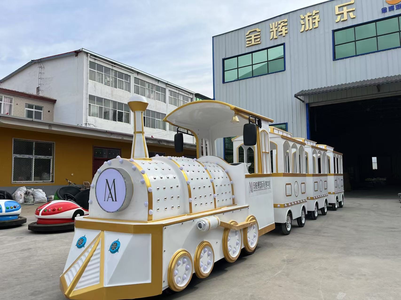 Trackless train traveling through a beautiful landscape with passengers enjoying the ride