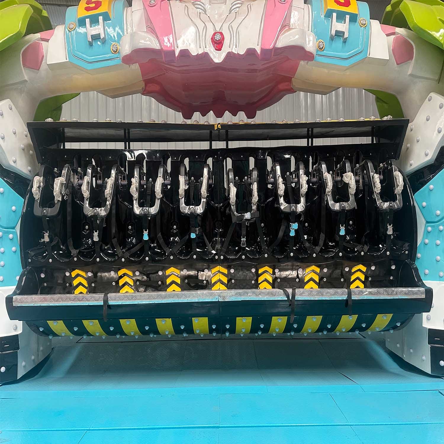 Interstellar Warrior ride passenger seats with safety harnesses