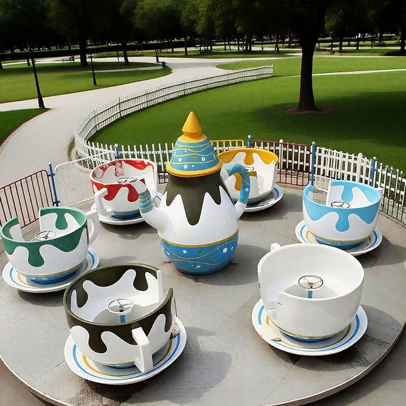 Coffee Cup Rides - Colorful spinning cups ride at amusement park